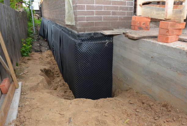 SJ Waterproofing Pros technician performing targeted Crawl Space Encapsulation assessment in Hudsonville, MI